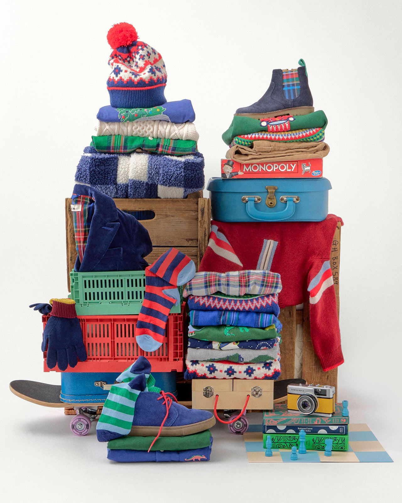 Stacks of clothing and accessories on a white background