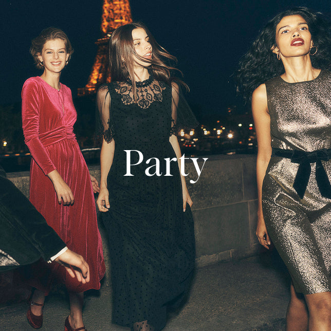 Three women in evening gowns with the word 'Party' in front of the Eiffel Tower.