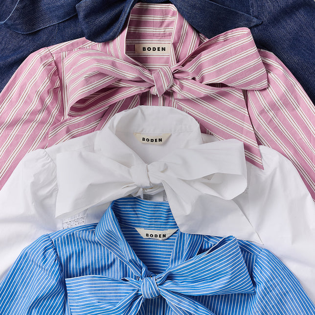 Collage of BODEN shirts with bow details in pink, white, and blue.