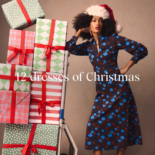 Woman in a festive outfit with Christmas presents and text '12 dresses of Christmas' on a brown background