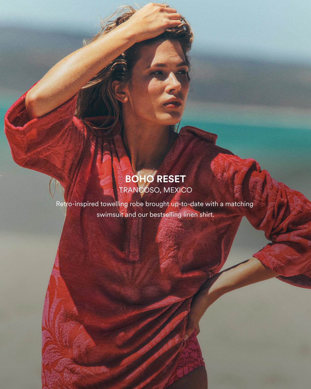Woman wearing a red towel robe on a beach with text overlay.