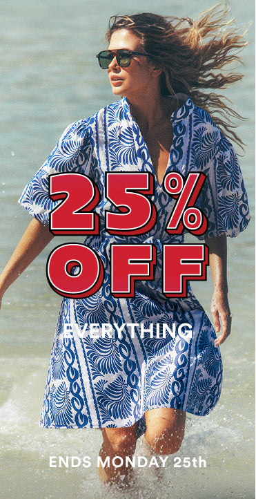 Woman in a blue patterned dress standing in water with promotional text overlay.
