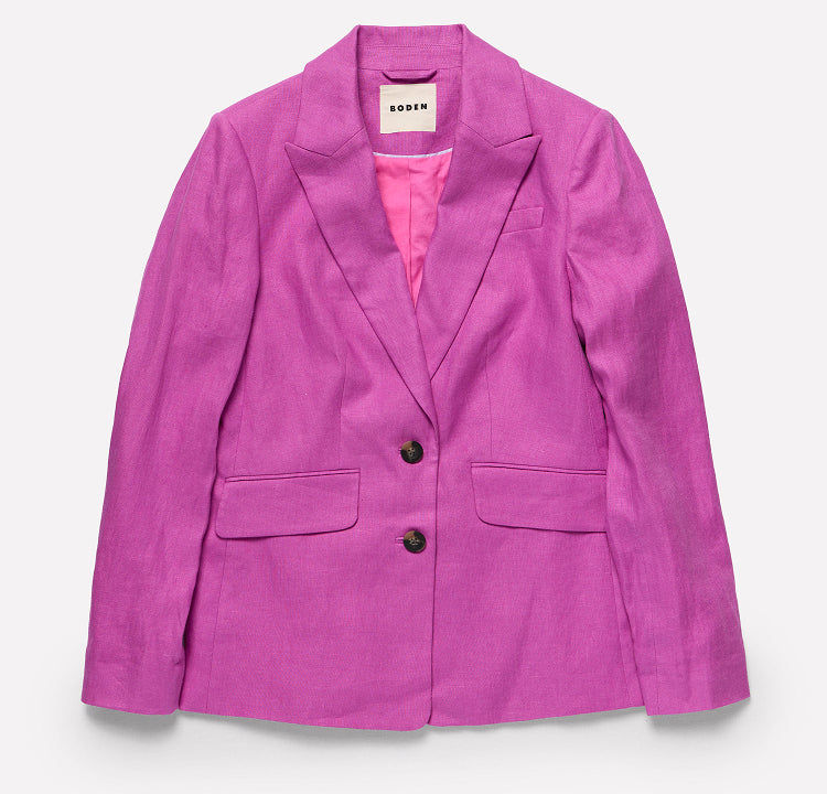 Purple blazer with a pink shirt underneath on a white background