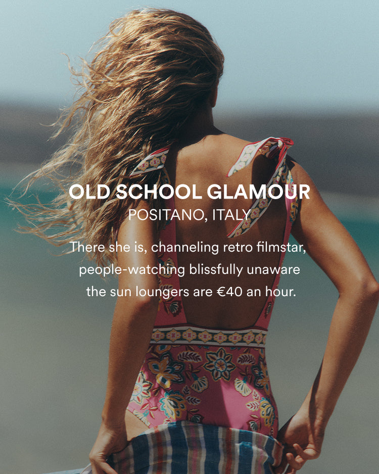 Woman in a colorful dress standing on a beach with text overlay about Old School Glamour in Positano, Italy.