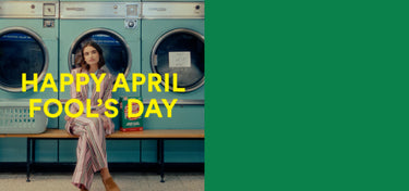 Person sitting on a bench with washing machines, text 'Happy April Fool's Day' on a green background