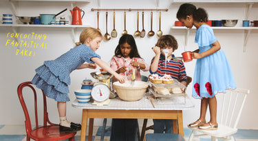 Children in a kitchen setting with cooking utensils and ingredients.