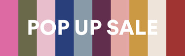 A promotional banner with the words 'POP UP SALE' in large white letters over vertical multicolored stripes.
