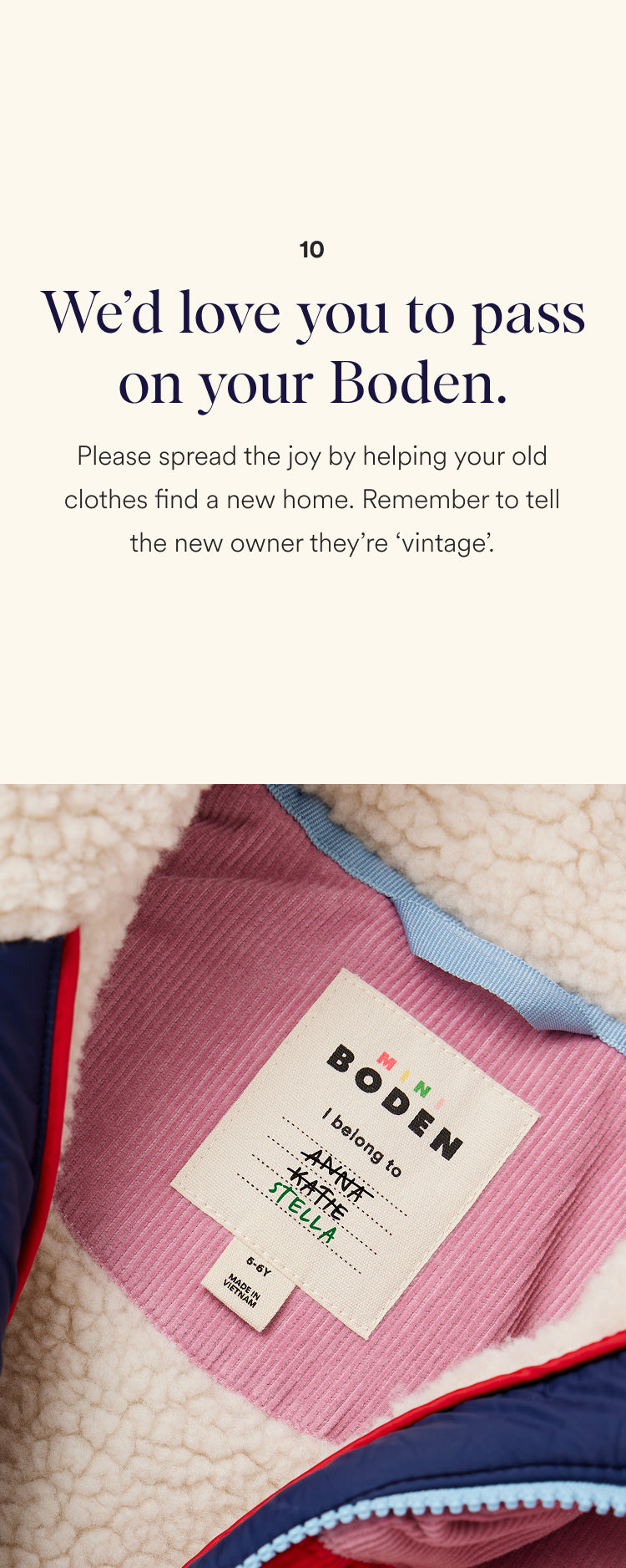 Pink garment with a Boden label on a textured surface