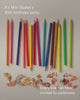 A collection of colourful pencils, disappearing and appearing in a disorderly line. 